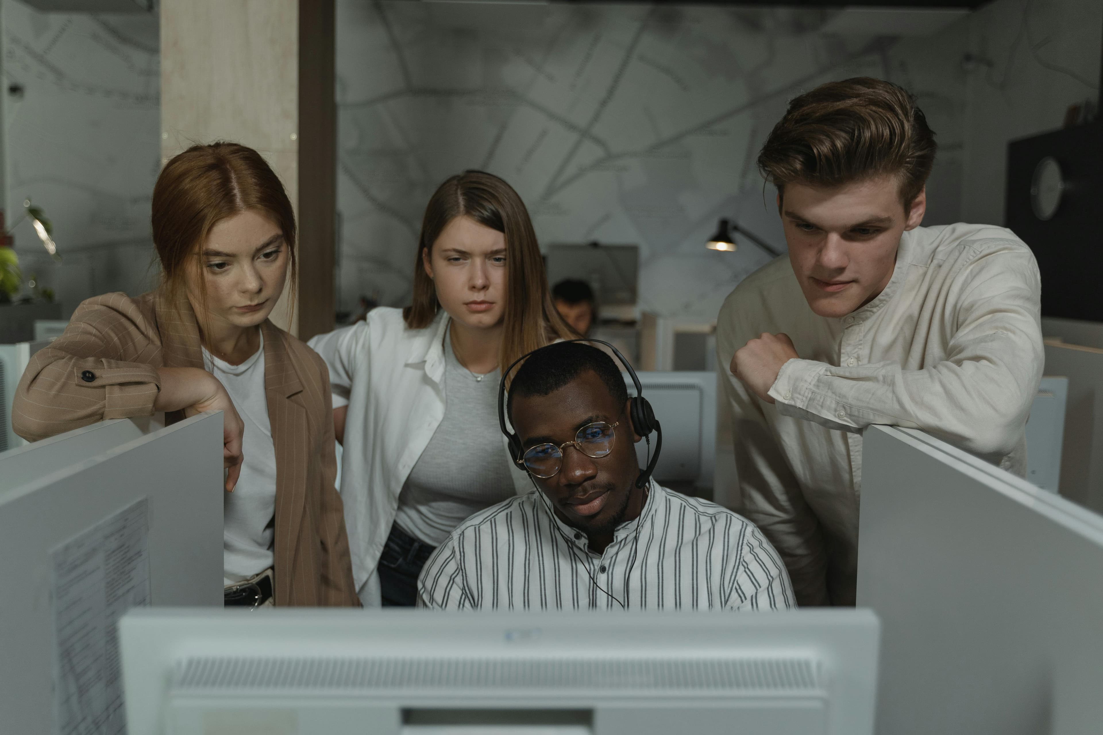 People working together in front of a computer