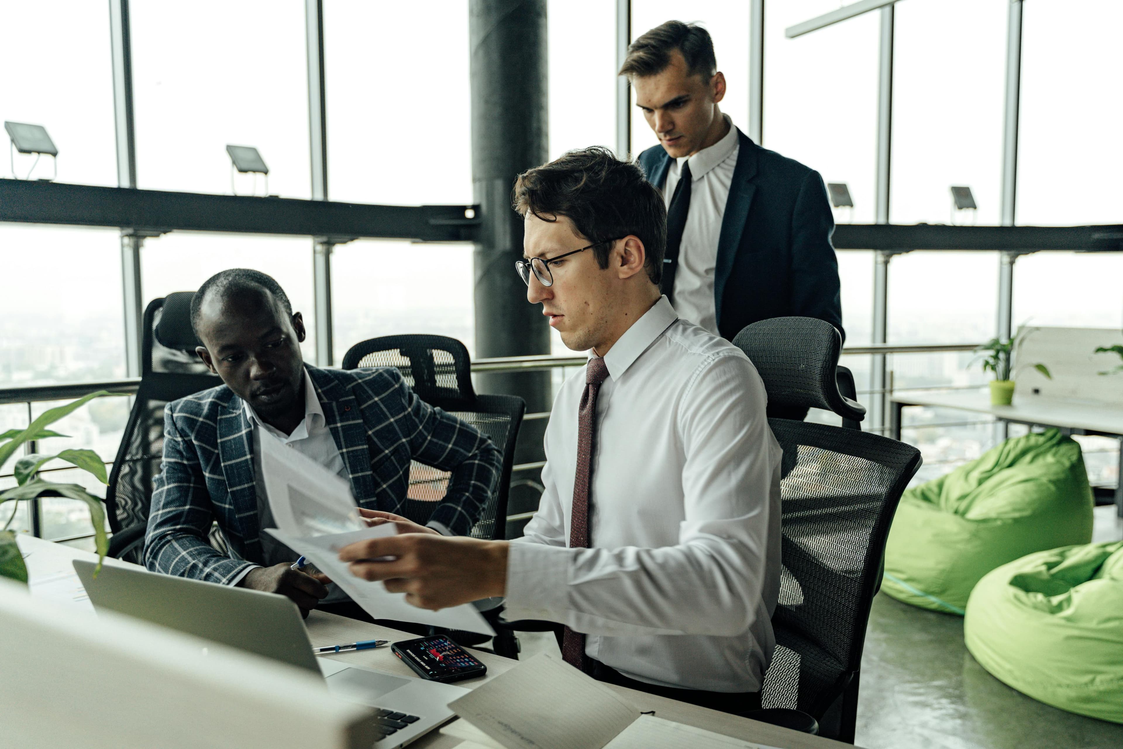 Three Men Working in an Office Together
